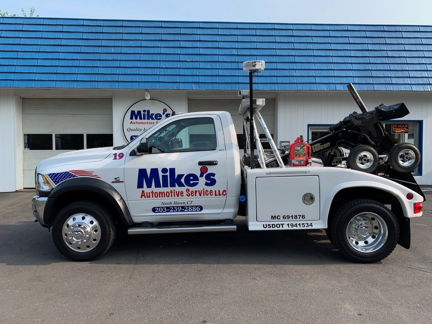 Mike's Automotive Service shop and wrecker at 410 Clintonville Rd